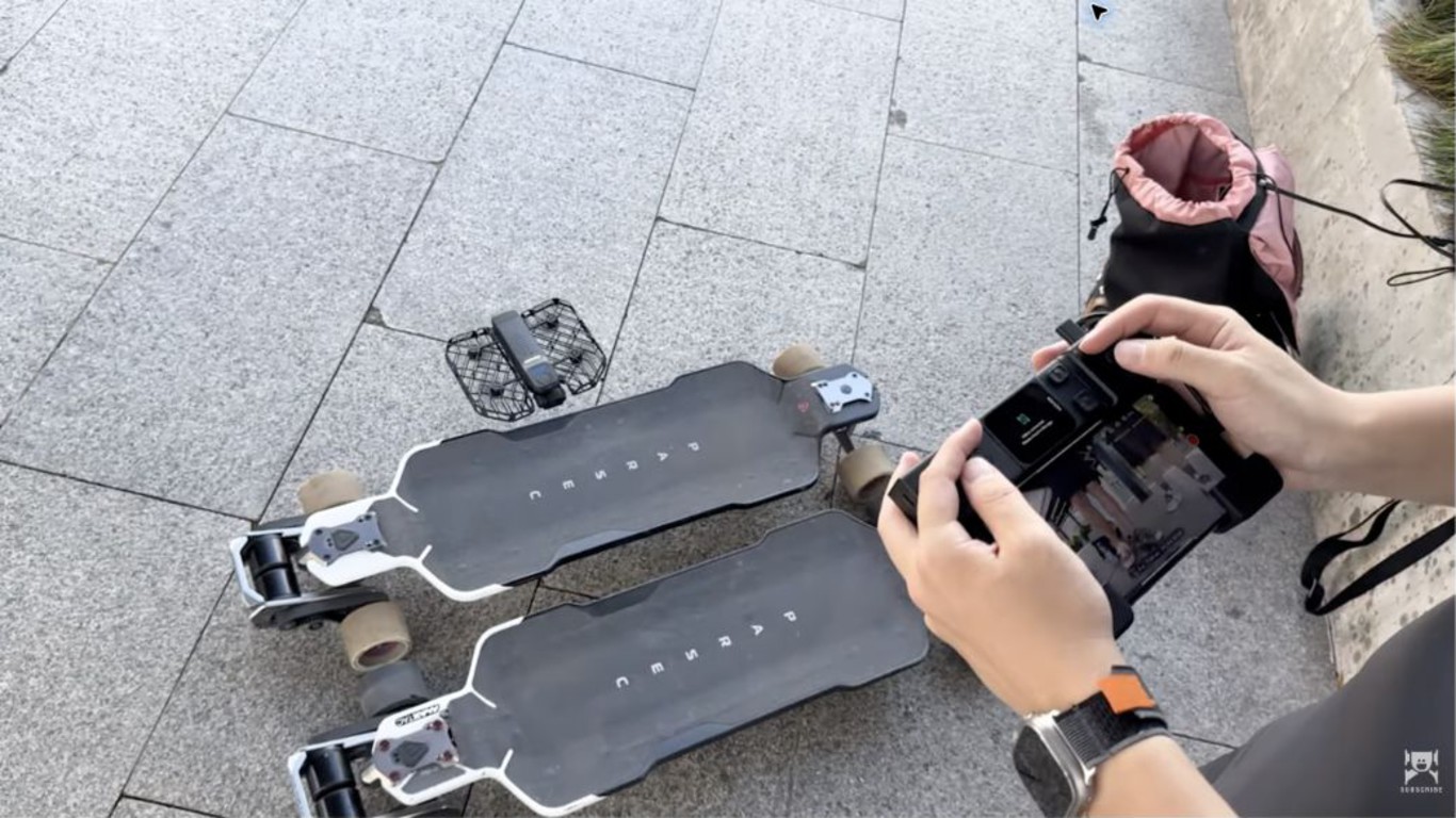 Hover Beacon controller in use beside the Hover X1 ProMax and electric skateboards