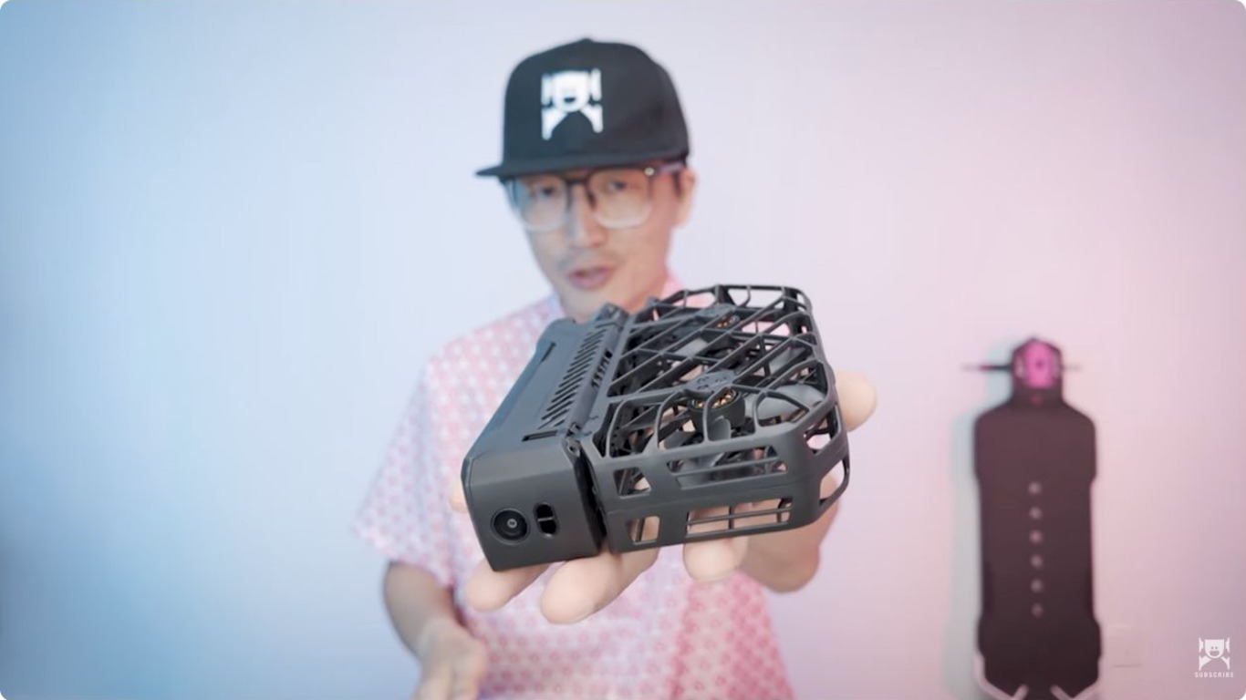 Hover X1 ProMax drone held close to the camera to show its compact size
